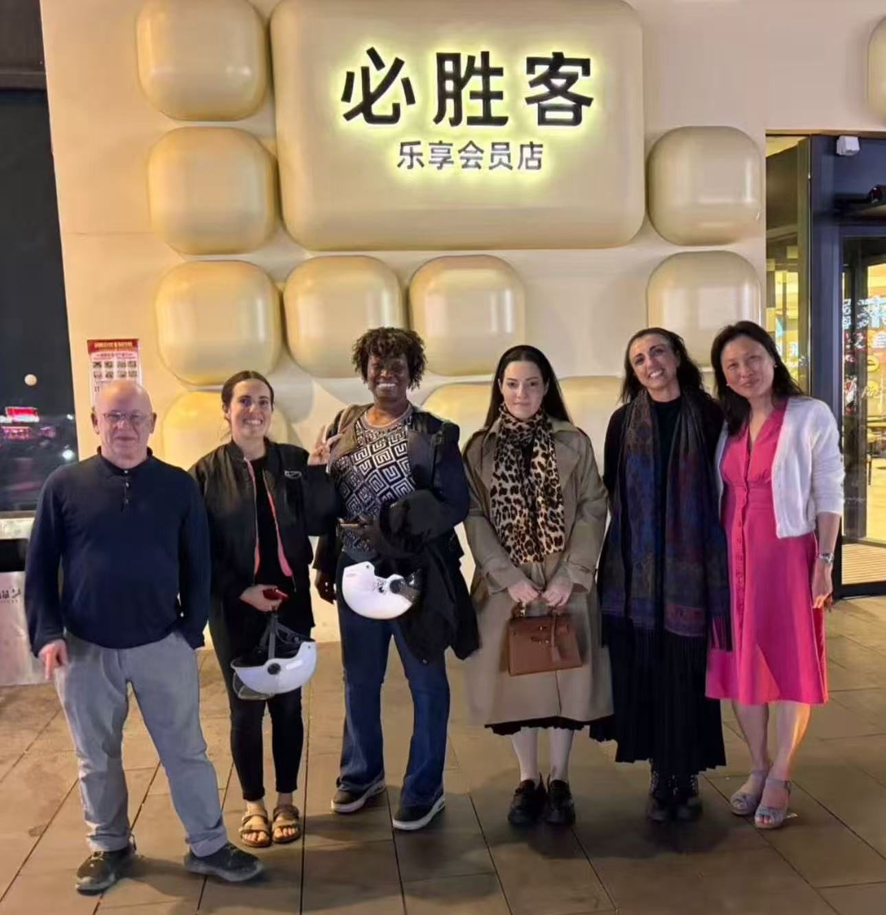 Visiting experts outside a restaurant in China