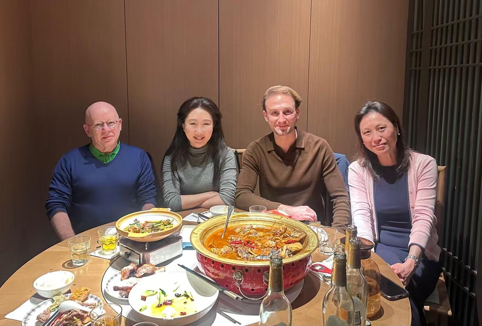 Colleagues around a hotpot dinner