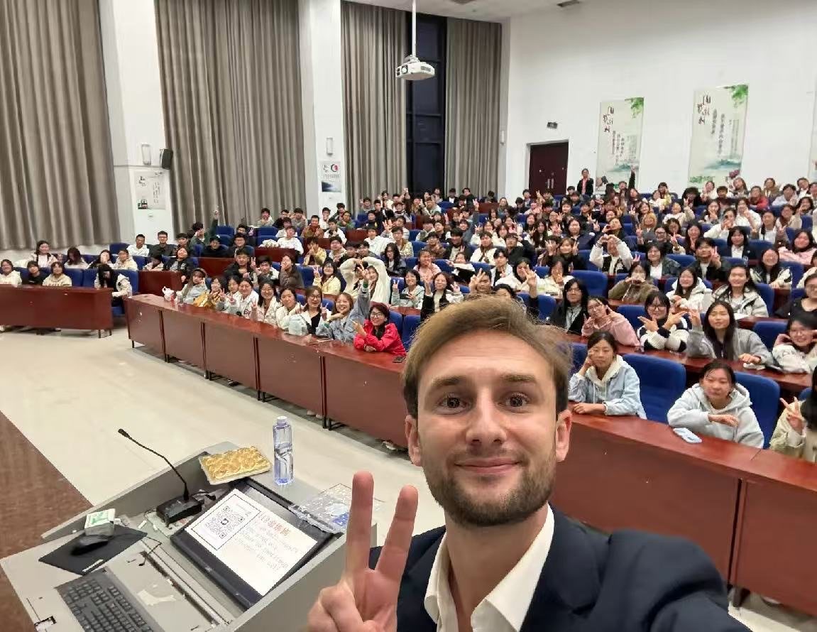Visiting expert lecturing to a full hall of Chinese students