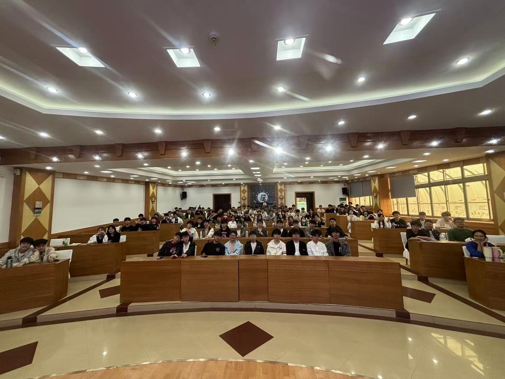 A full lecture hall of students at a partner university in China