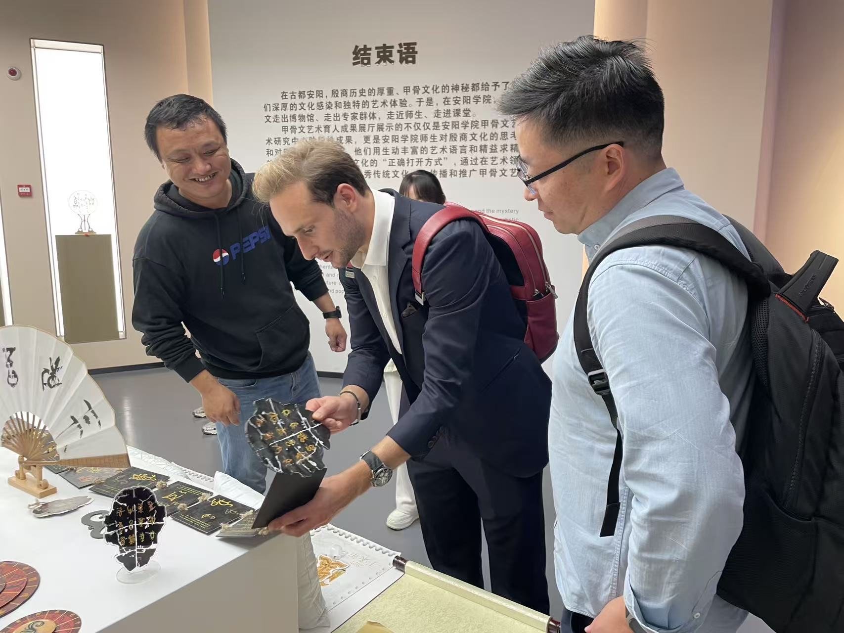 Visiting experts at an oracle-bone art exhibition